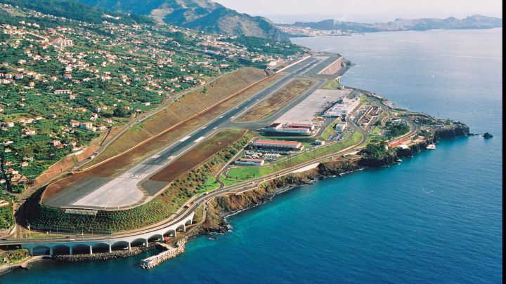 Aerial view of Madeira International Airport runway above the Atlantic Ocean